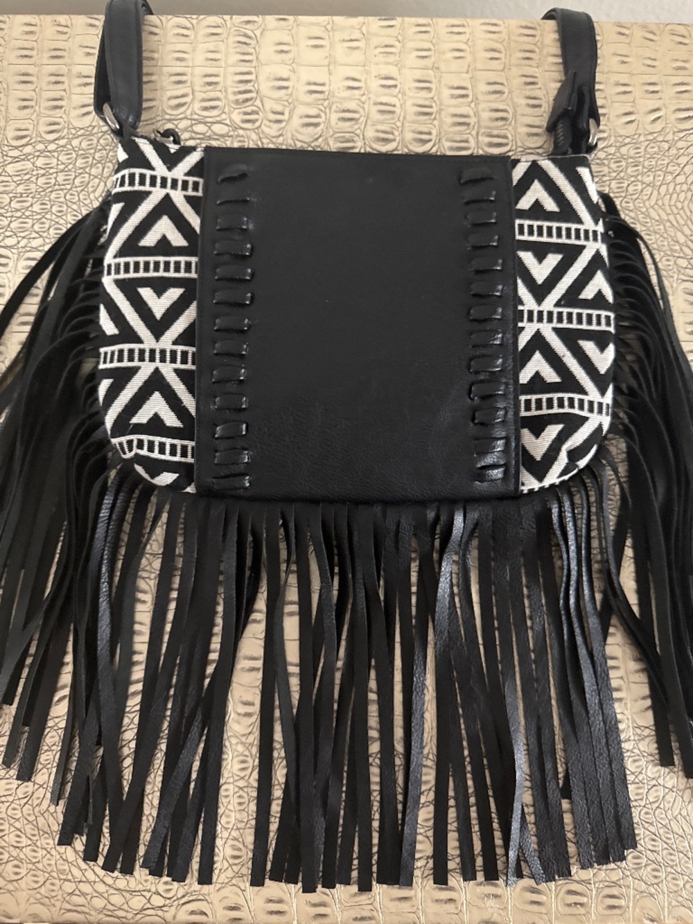Black boho-style crossbody bag